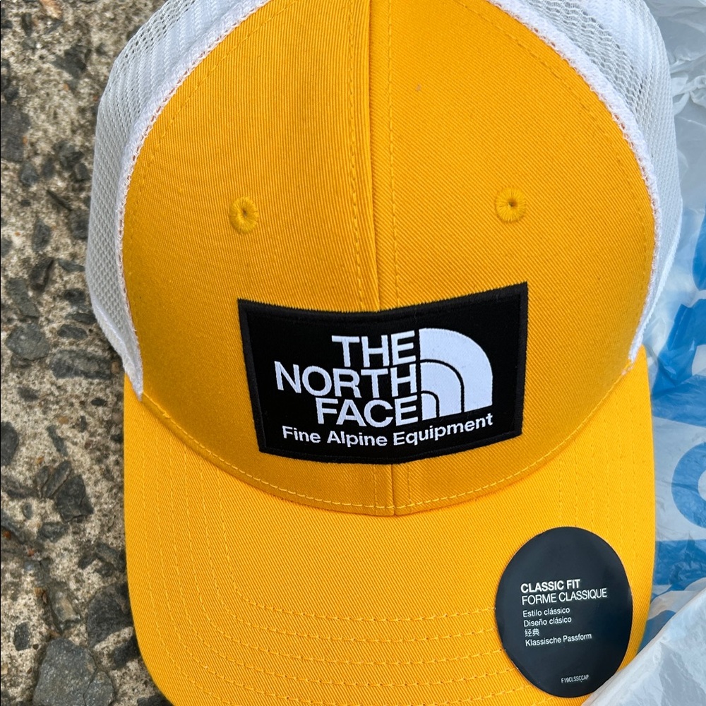 The North Face Yellow and White Trucker Hat